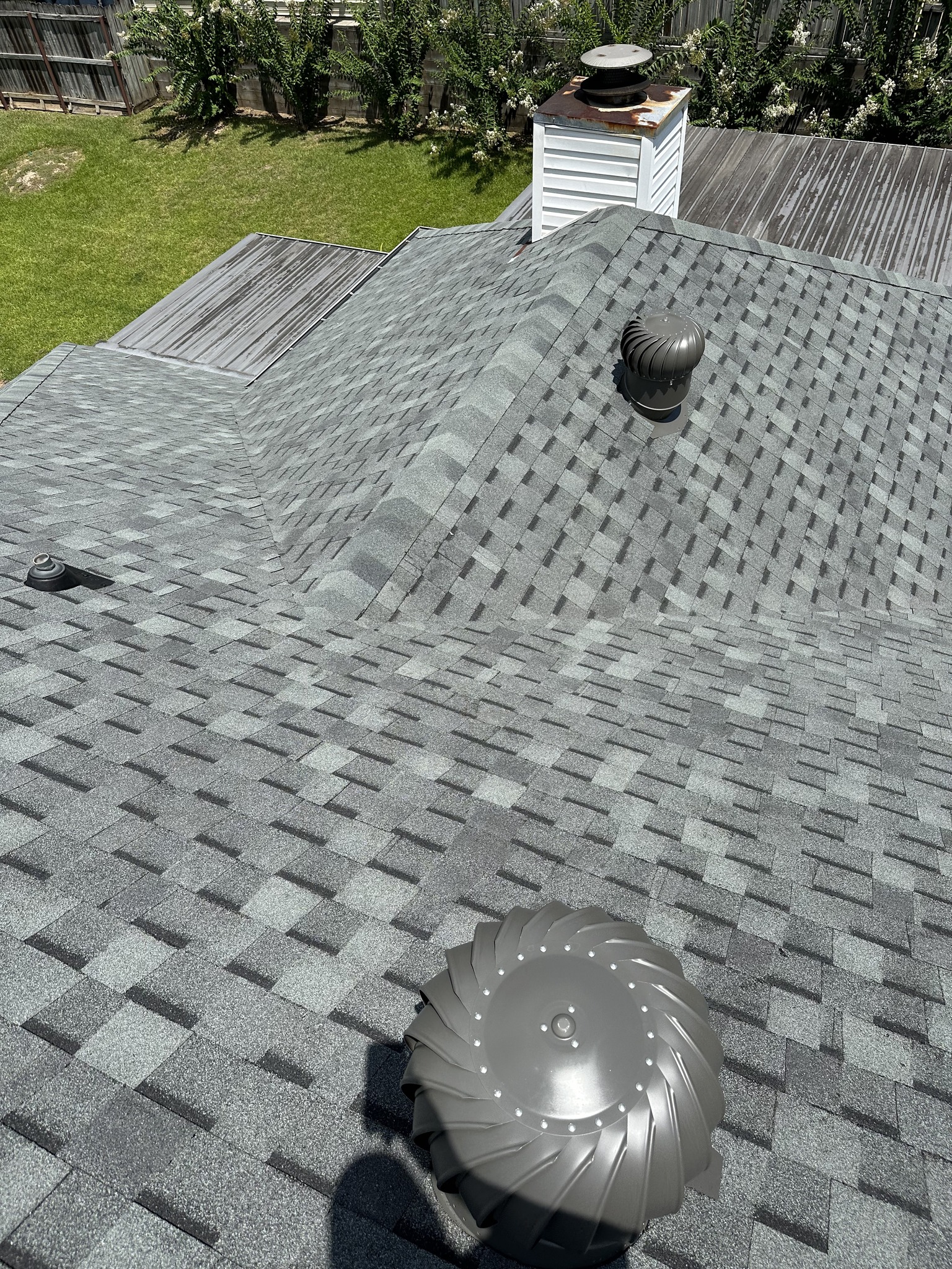 Close up of asphalt shingle roofing installation