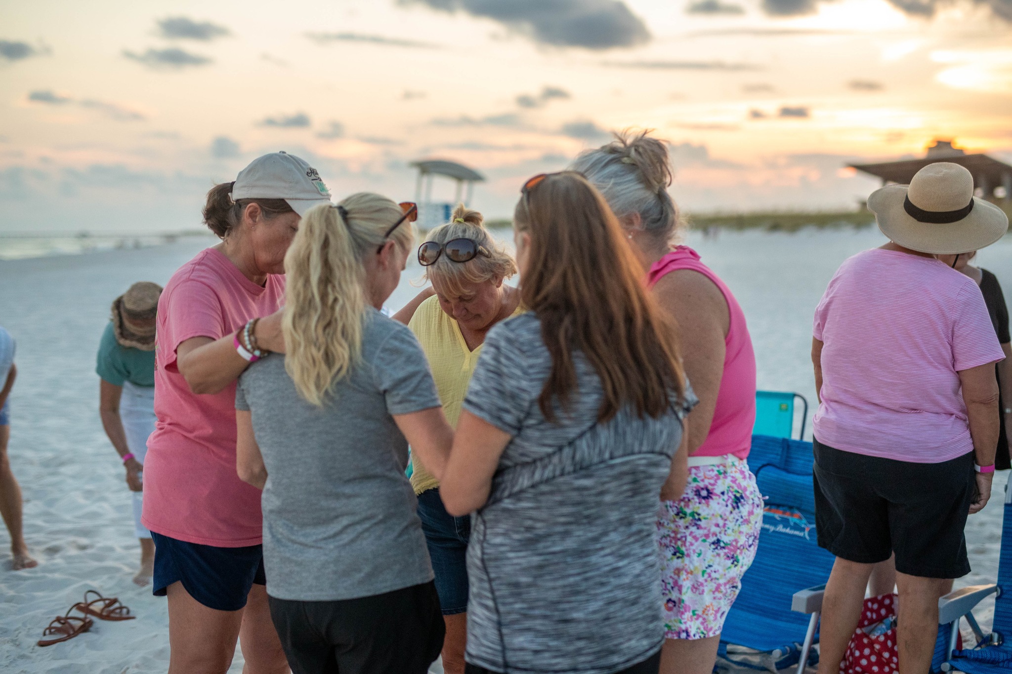 Women praying together at The Island Church