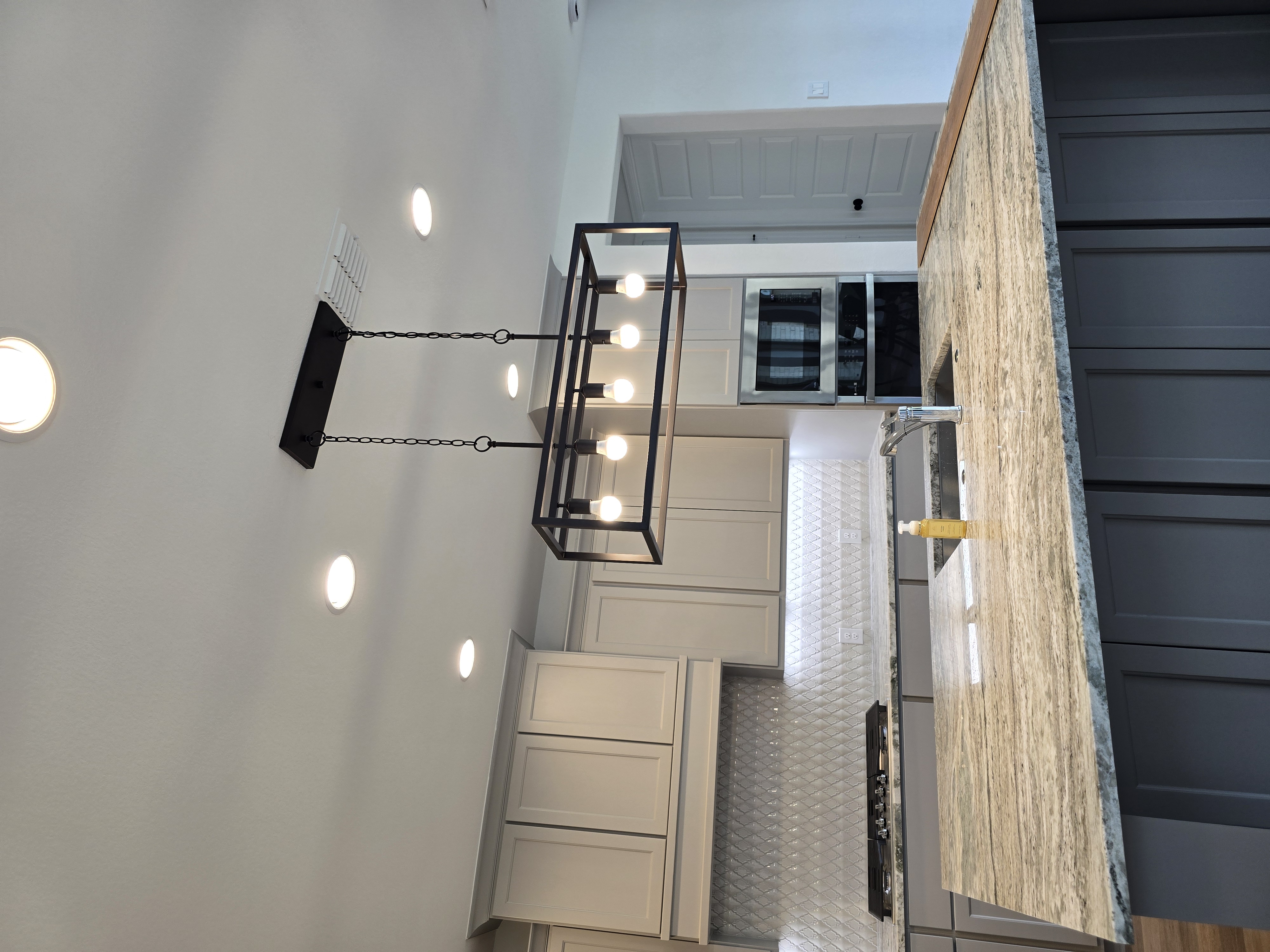 De Leon Solutions - Modern kitchen renovation with lighting