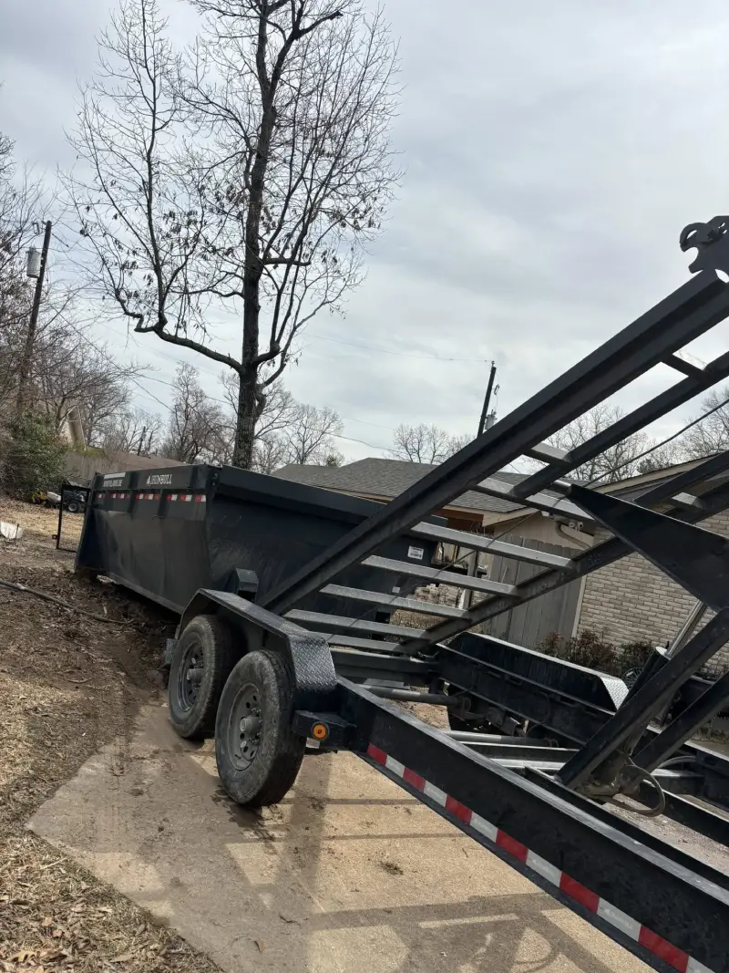 Ironbull roll-off dumpster trailer parked on a driveway