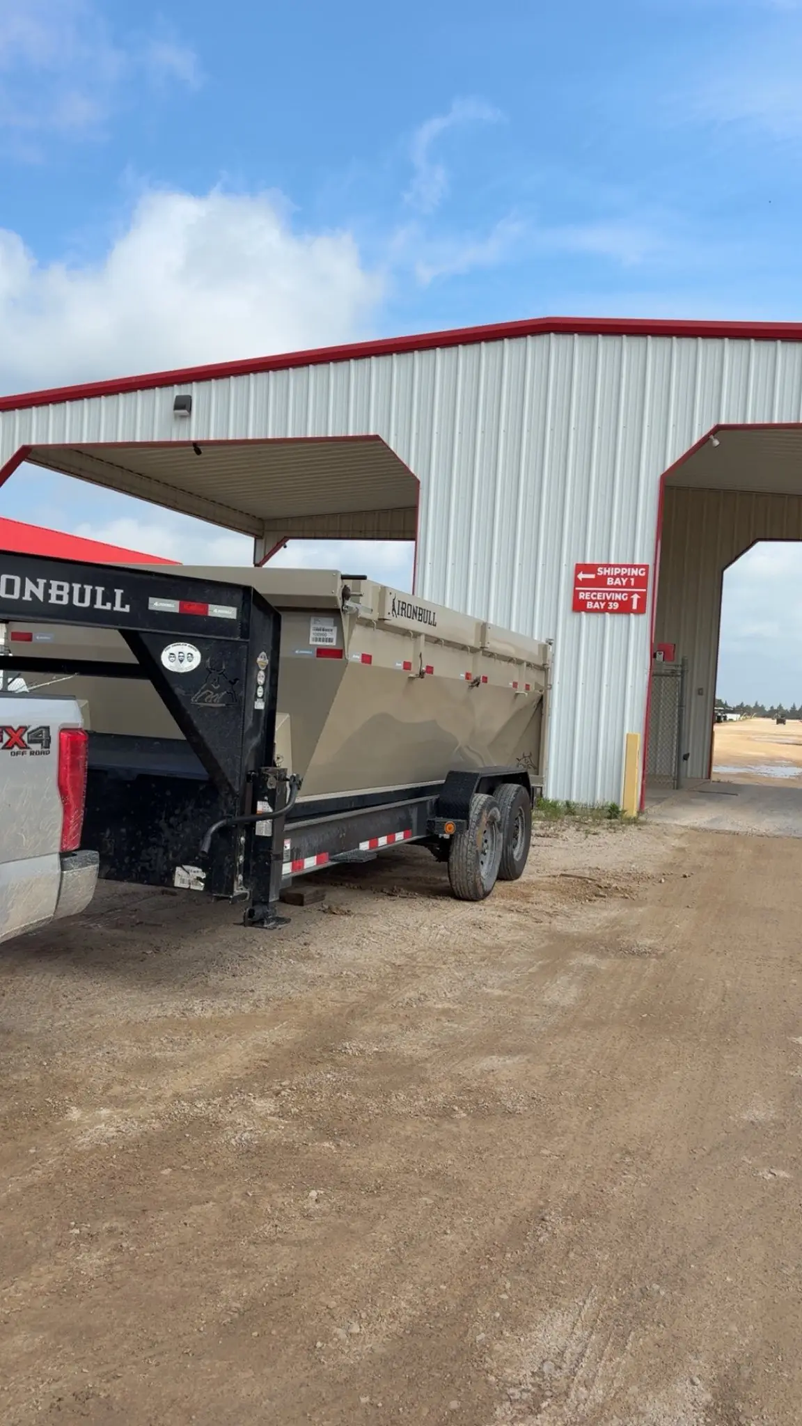Ironbull dump trailer parked at an industrial building