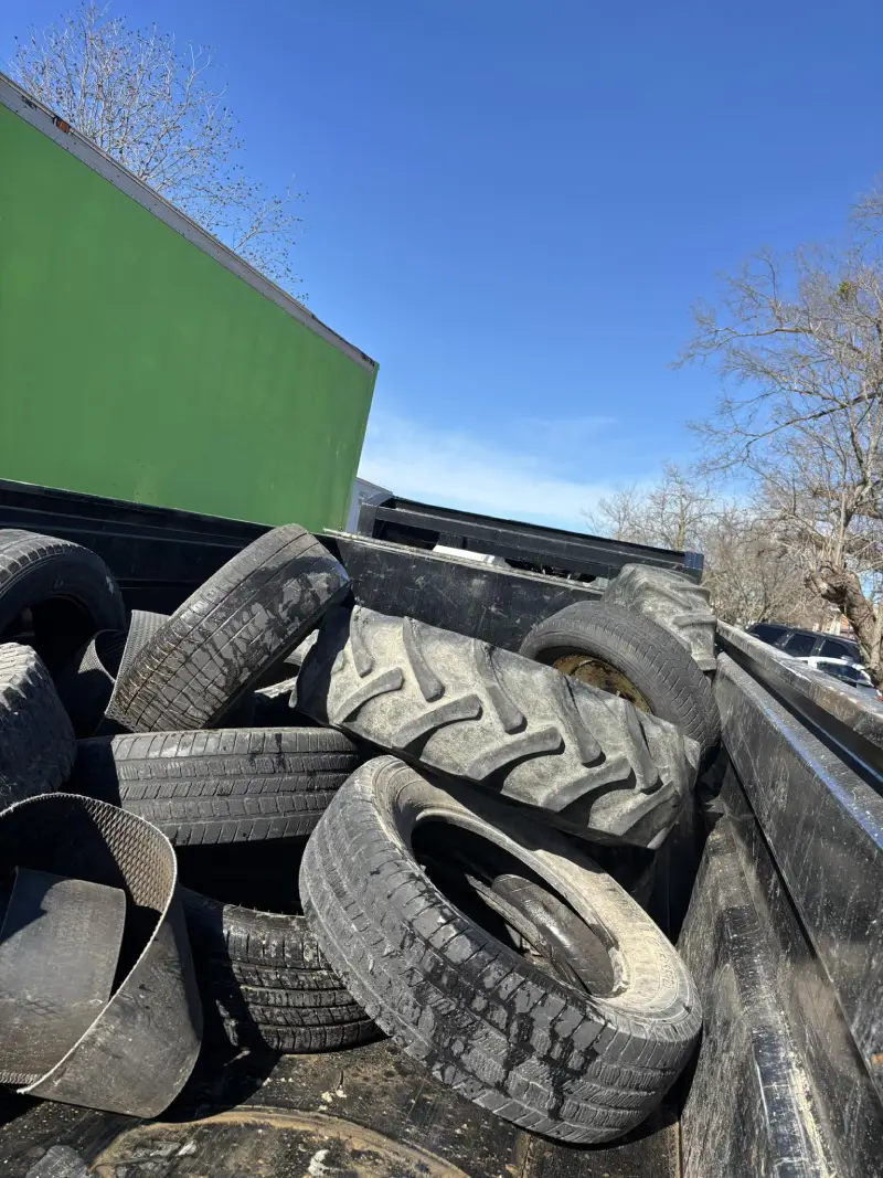 Dumpster filled with old tires
