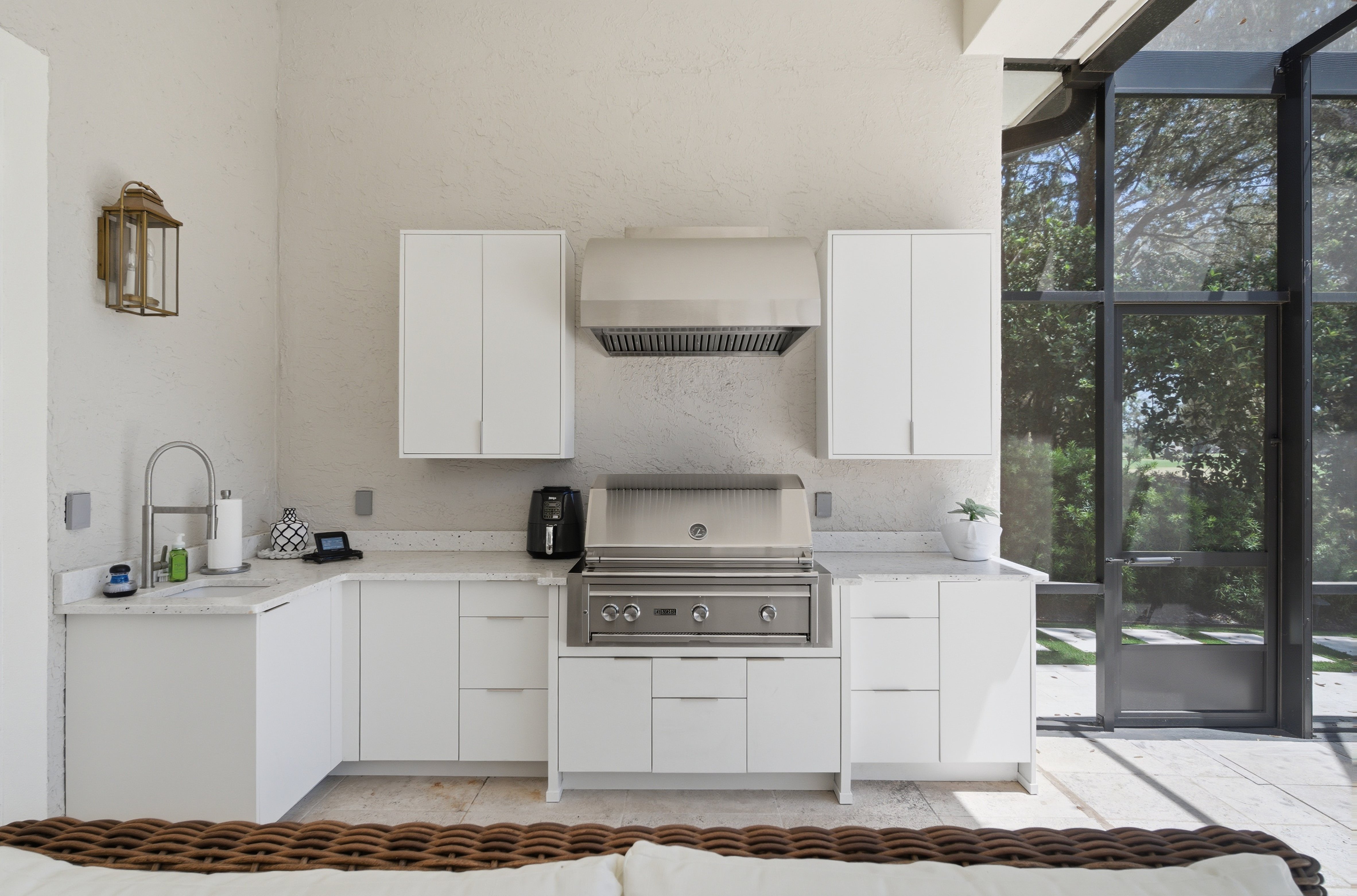 Full outdoor kitchen with stainless grill