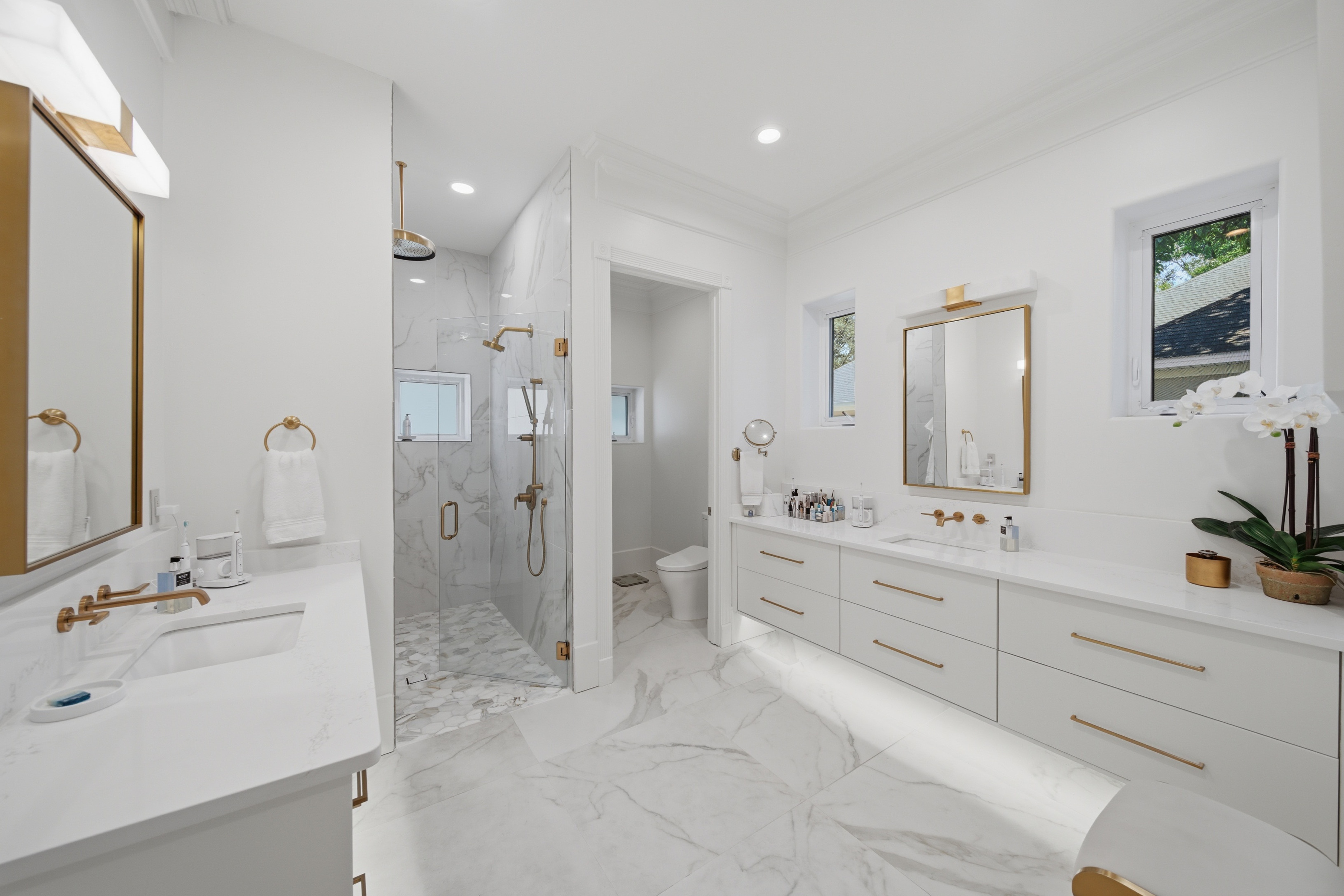 Primary bath with stone roll-in shower