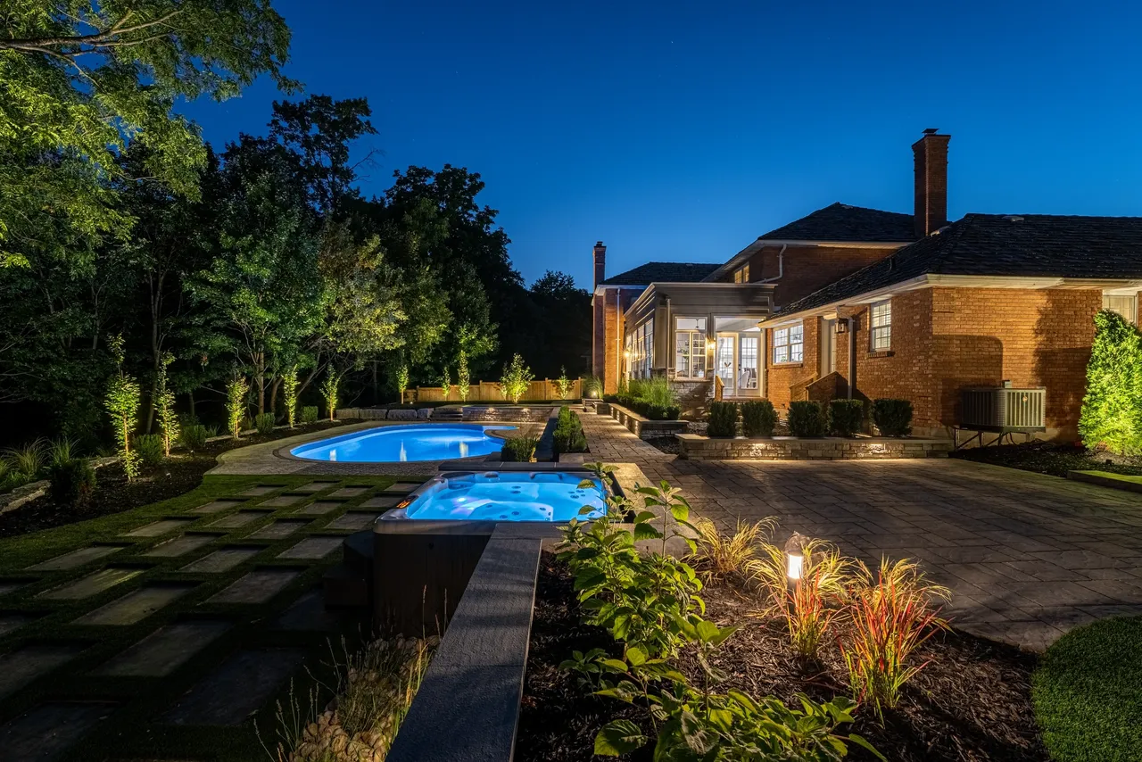 Custom rock garden with stone bridge and water feature London Ontario