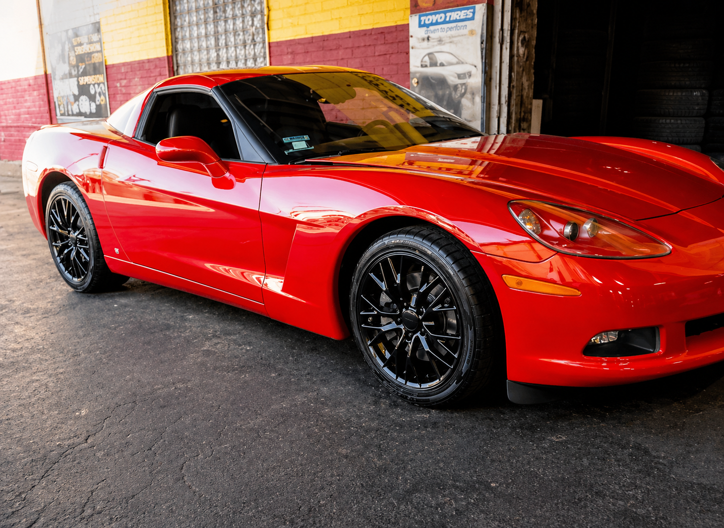 Red Corvette with custom wheels