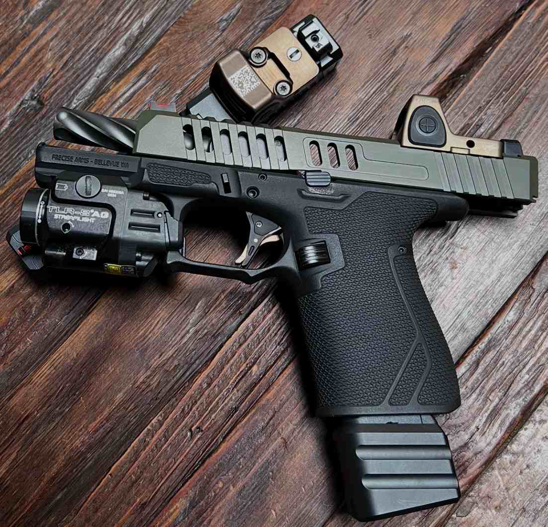 Two bronze-finished custom pistols by Precise Arms.