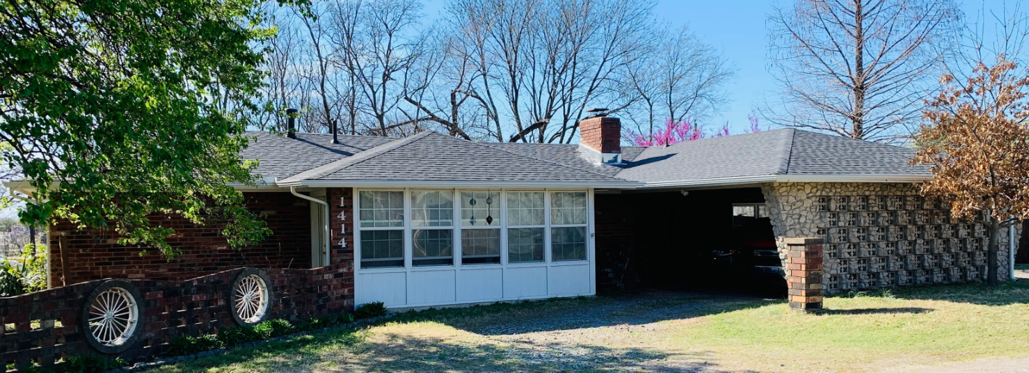 New architectural shingle roof replacement on a brick home in Broken Arrow, OK