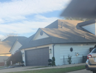 Side view of a new architectural shingle roof replacement in Broken Arrow, OK