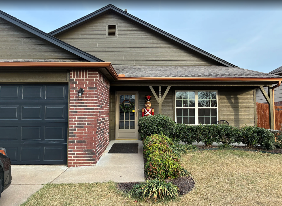 Owasso home after new siding installation and exterior painting