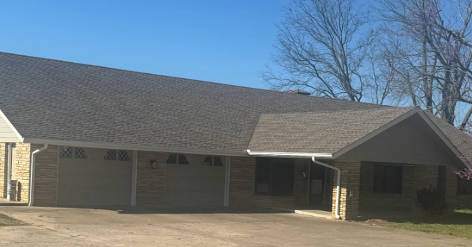 New roof replacement and exterior repairs on a stone home in Tulsa, Oklahoma