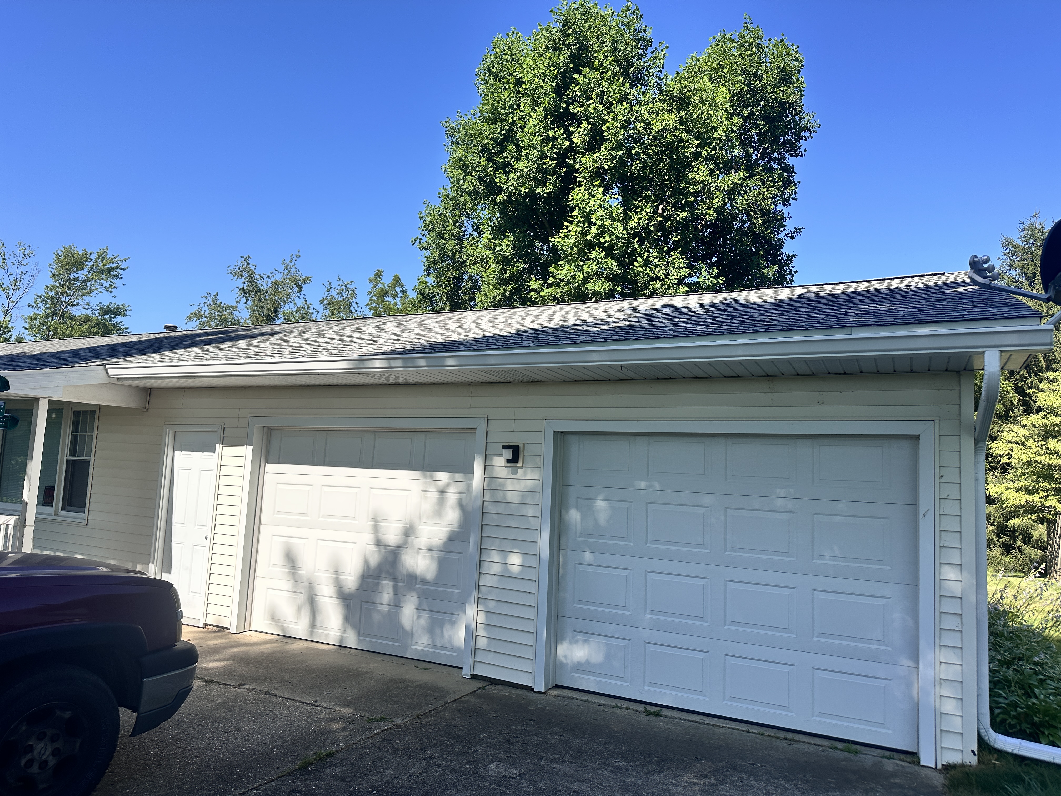 RetroFlow Gutters professional hand-cleaning gutters, removing debris safely and effectively