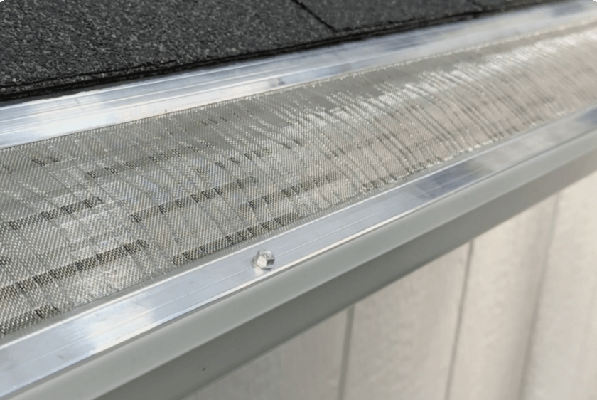 Close-up of a RetroFlow Gutters install showing LeafBlaster Pro micro-mesh guard