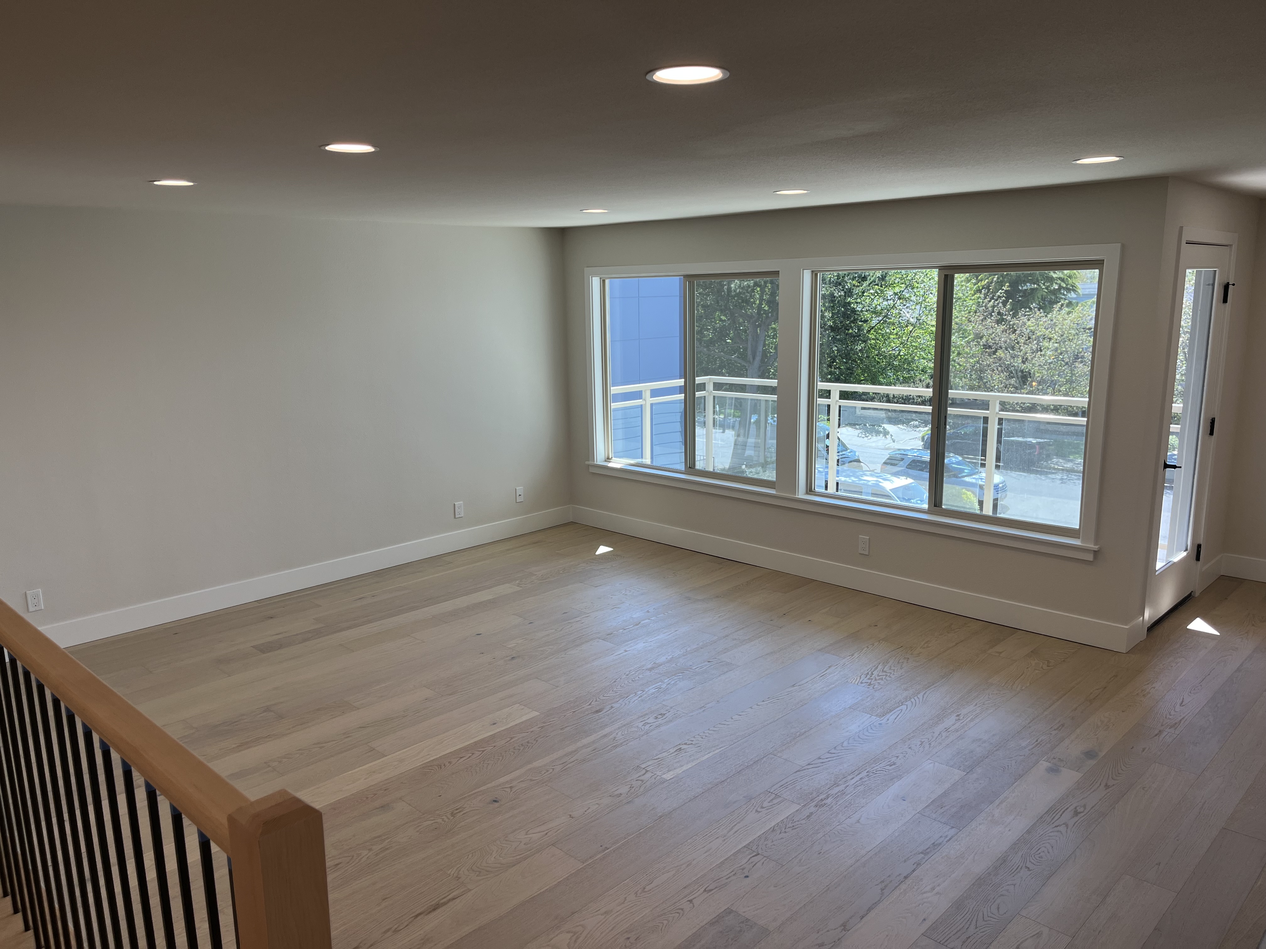 Bright living space with recessed ceiling lighting