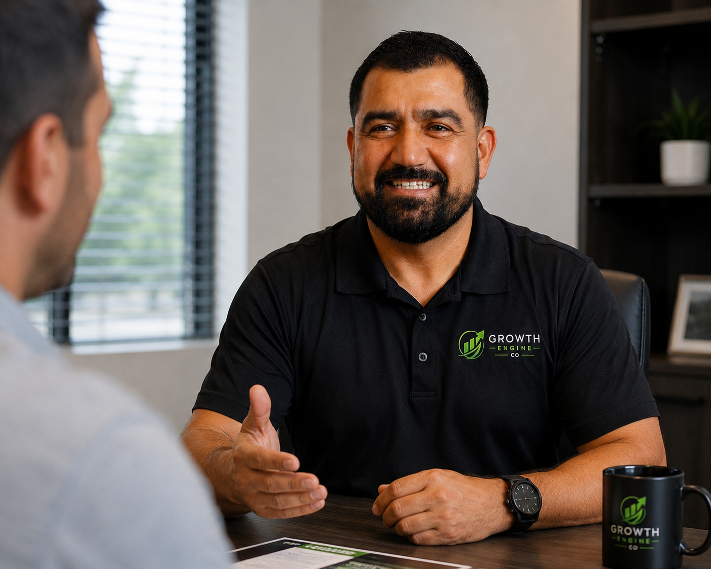 Growth Engine Co founder Jose Sesmas discussing AI automation strategy with a business owner