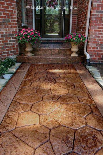 Synthetic turf installation paired with natural stone step pavers in Oxnard coastal residence