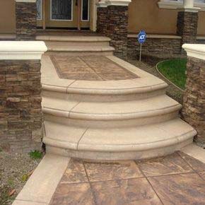 Interlocking paver driveway installation with cobble border and integrated estate drainage in Somis