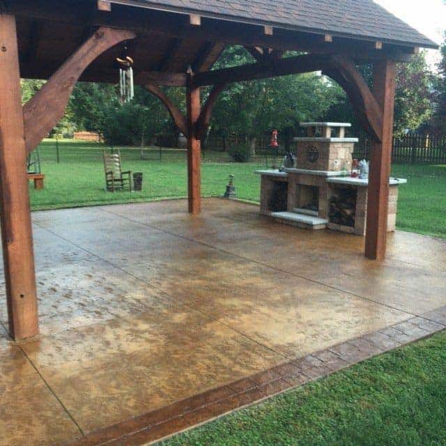 Custom timber pavilion with stone pillars over outdoor patio in Lake Sherwood