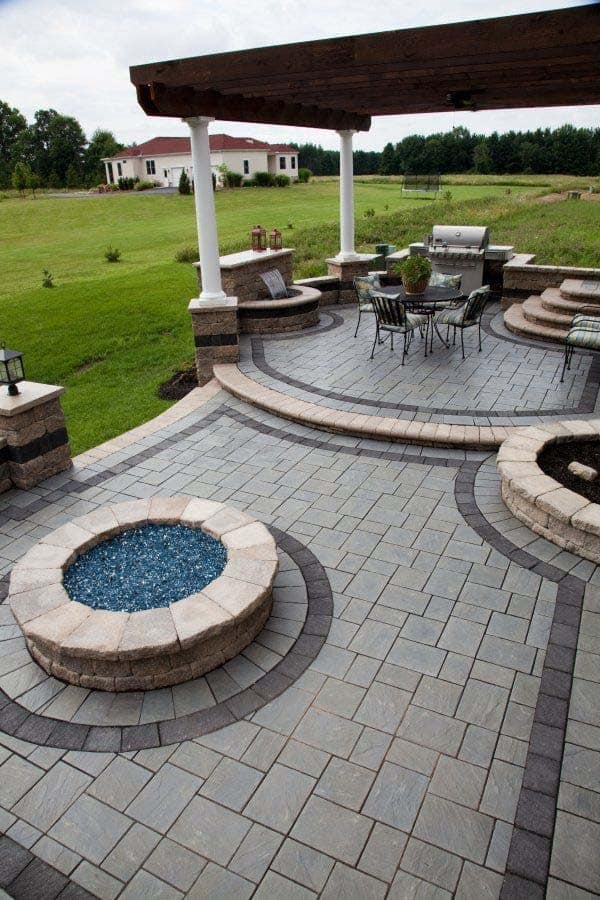 Gas fire feature integrated into low stone retaining wall in Moorpark estate