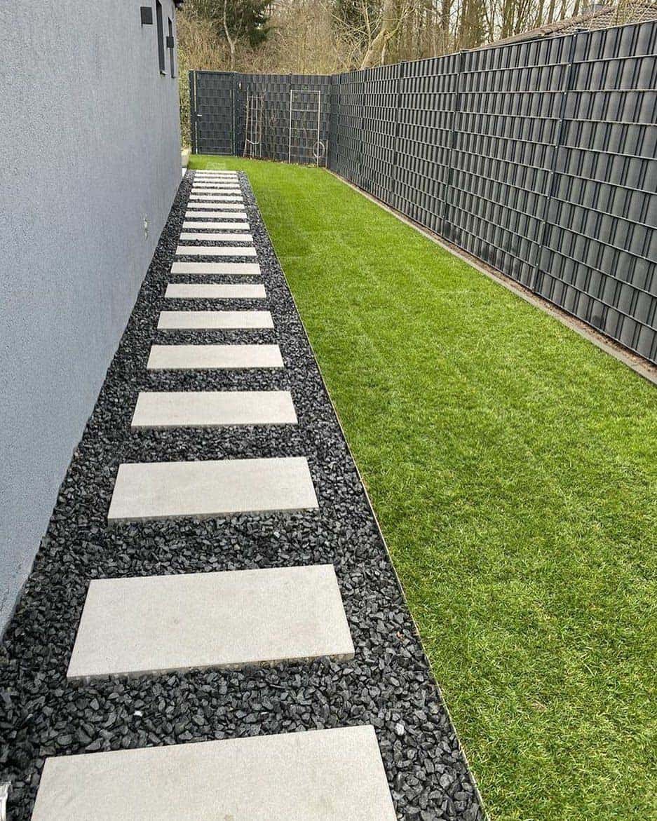Water-wise landscaping with drought-tolerant flora and flagstone walkway in Ventura