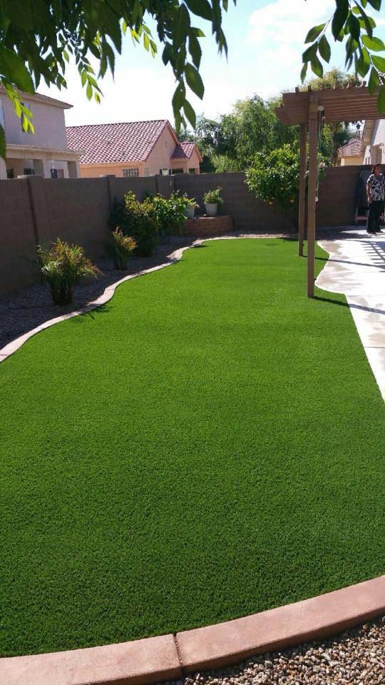 Synthetic putting green installation with sand bunker and fringe grass in Thousand Oaks estate
