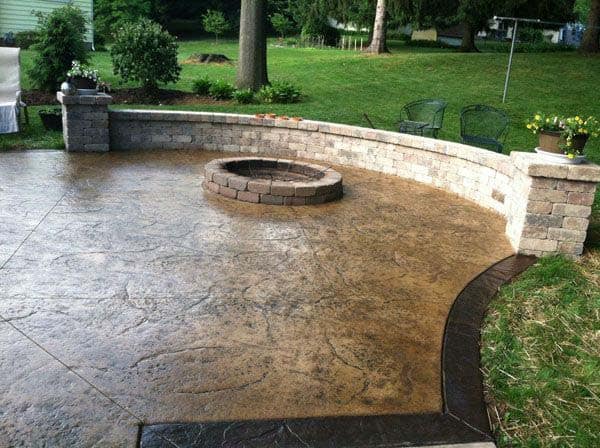 Custom stone retaining wall and terraced slope landscaping in Moorpark estate