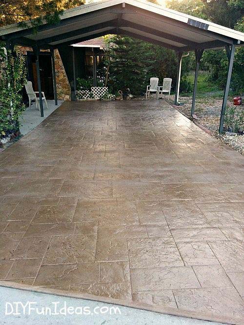 Architectural front yard makeover featuring modern step pavers, olive trees, and landscape lighting in Westlake Village