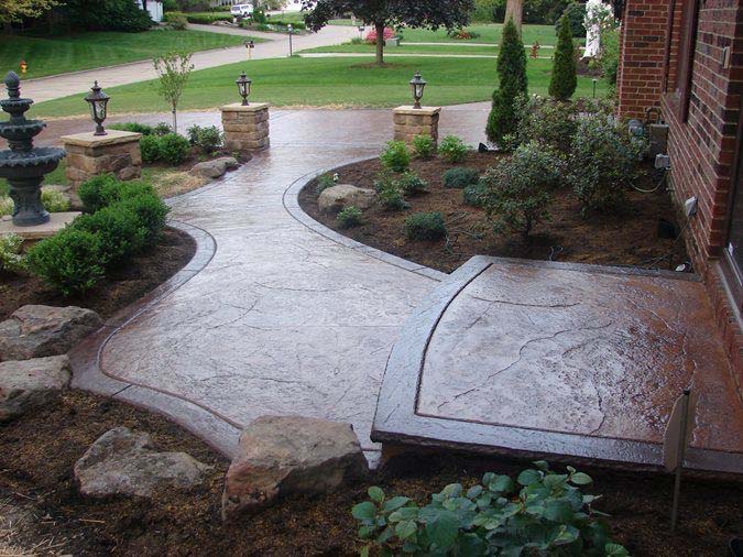 Stamped concrete patio with custom seating walls in Ventura County estate