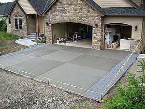 Custom pool build with dark pebble finish and stone travertine deck in Santa Rosa Valley