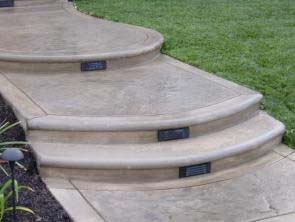 Stone hearth outdoor fireplace with TV mount in Camarillo