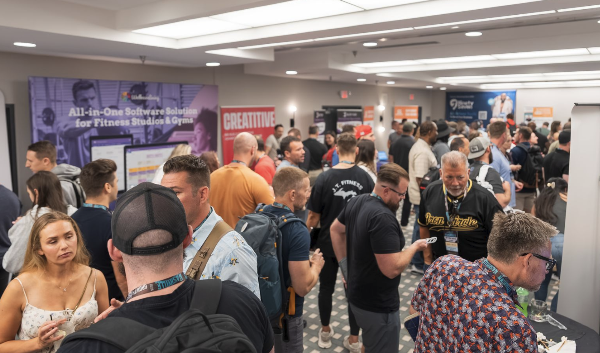 Sponsor exhibit hall and activation space at a live industry event