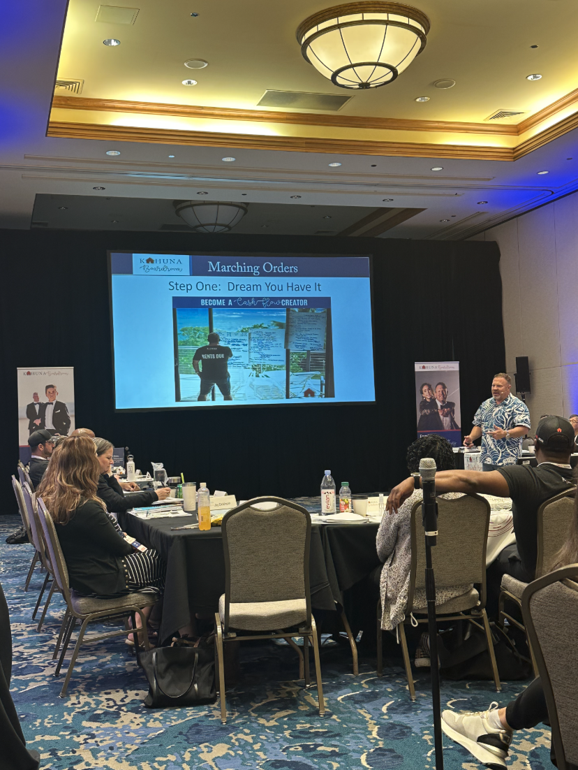 Conference ballroom training session with large-screen presentation and engaged audience