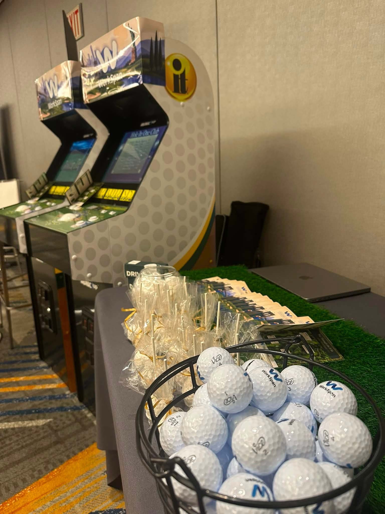 Custom branded arcade and golf sponsorship activation booth