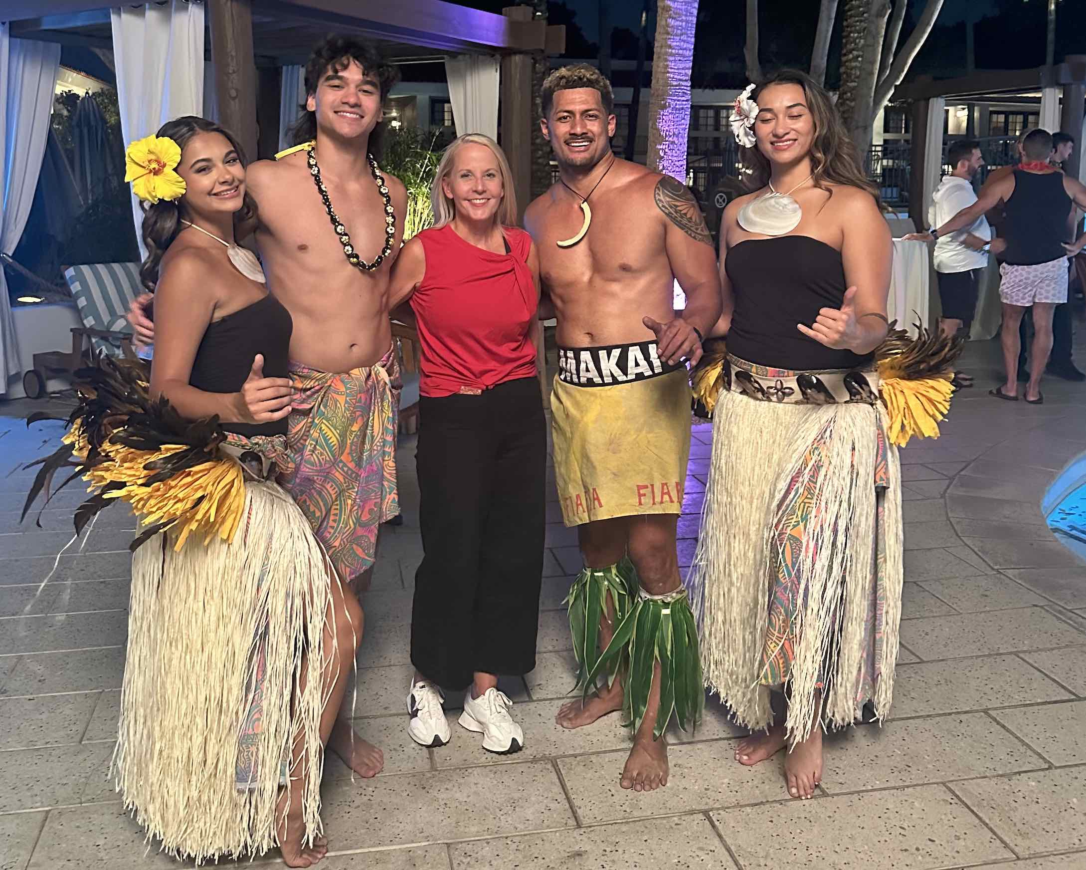 Amanda at conference afterparty luau entertainment with performers