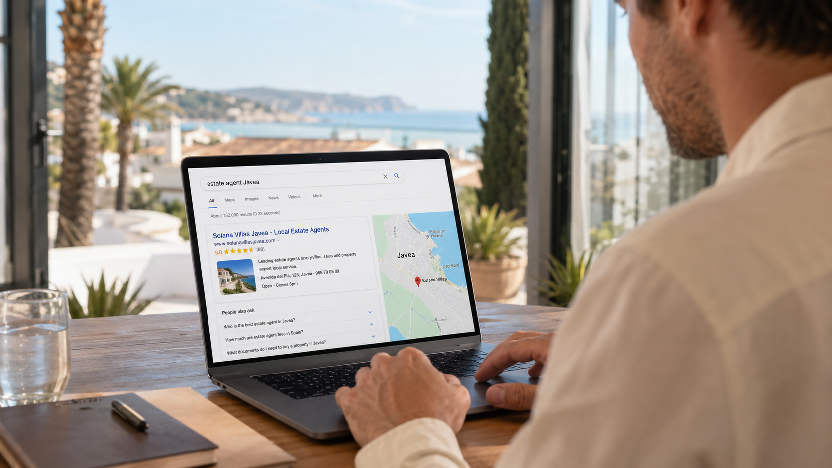 Javea business owner using a laptop to manage enquiries from their new website