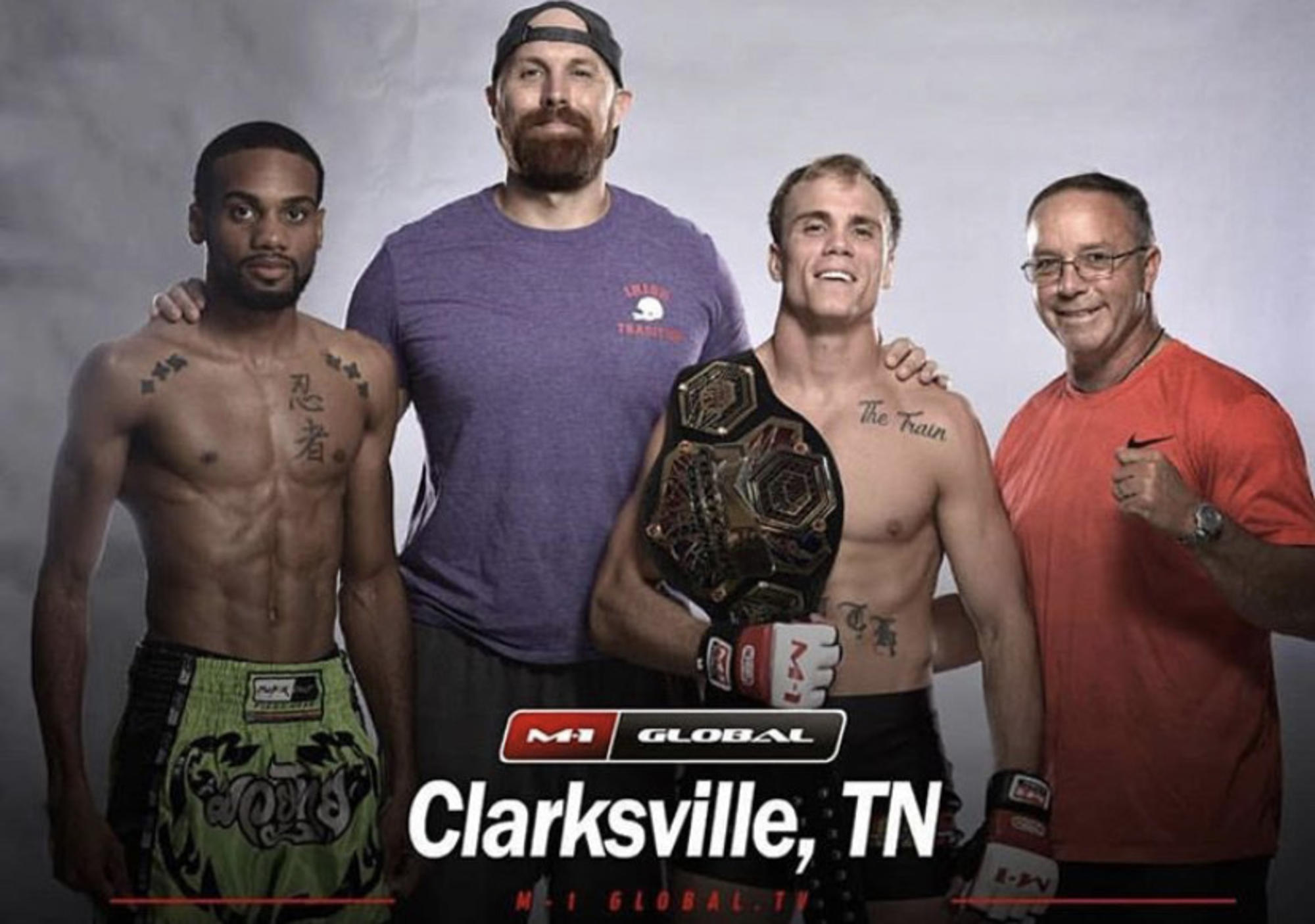 Fight Team Success Clarksville TN Wildside — team and coaches with a championship belt