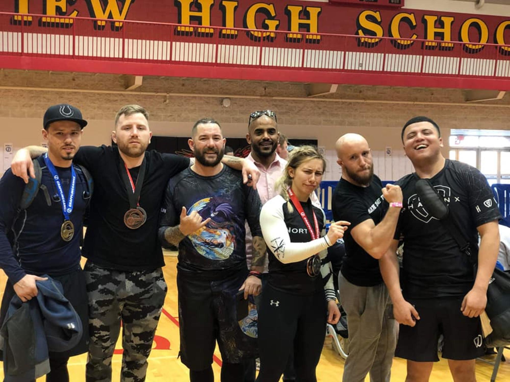 BJJ Tournament Clarksville TN Wildside — students celebrating medal wins at a jiu-jitsu competition