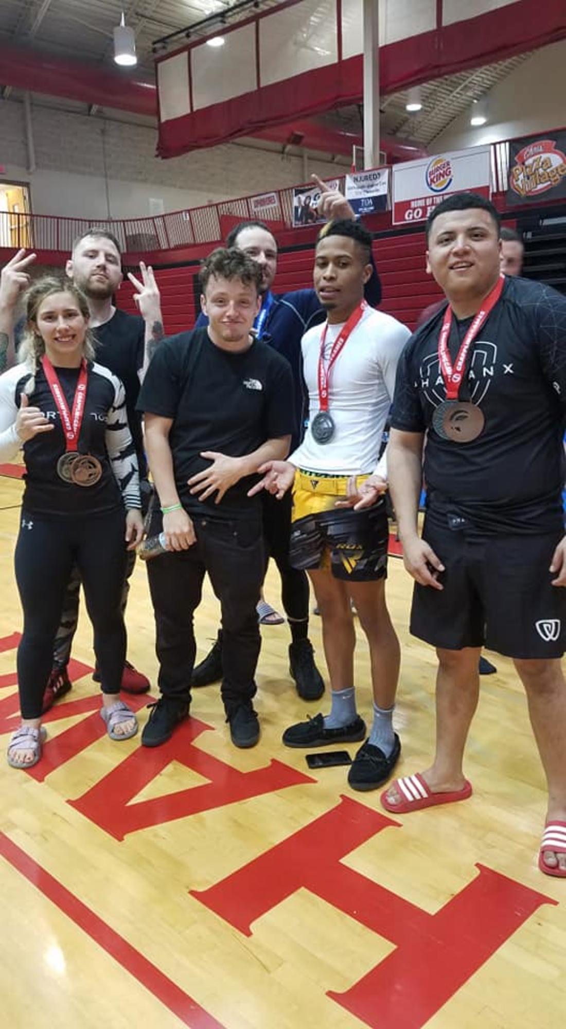 BJJ Tournament Clarksville TN Wildside — team members celebrating with medals at a competition