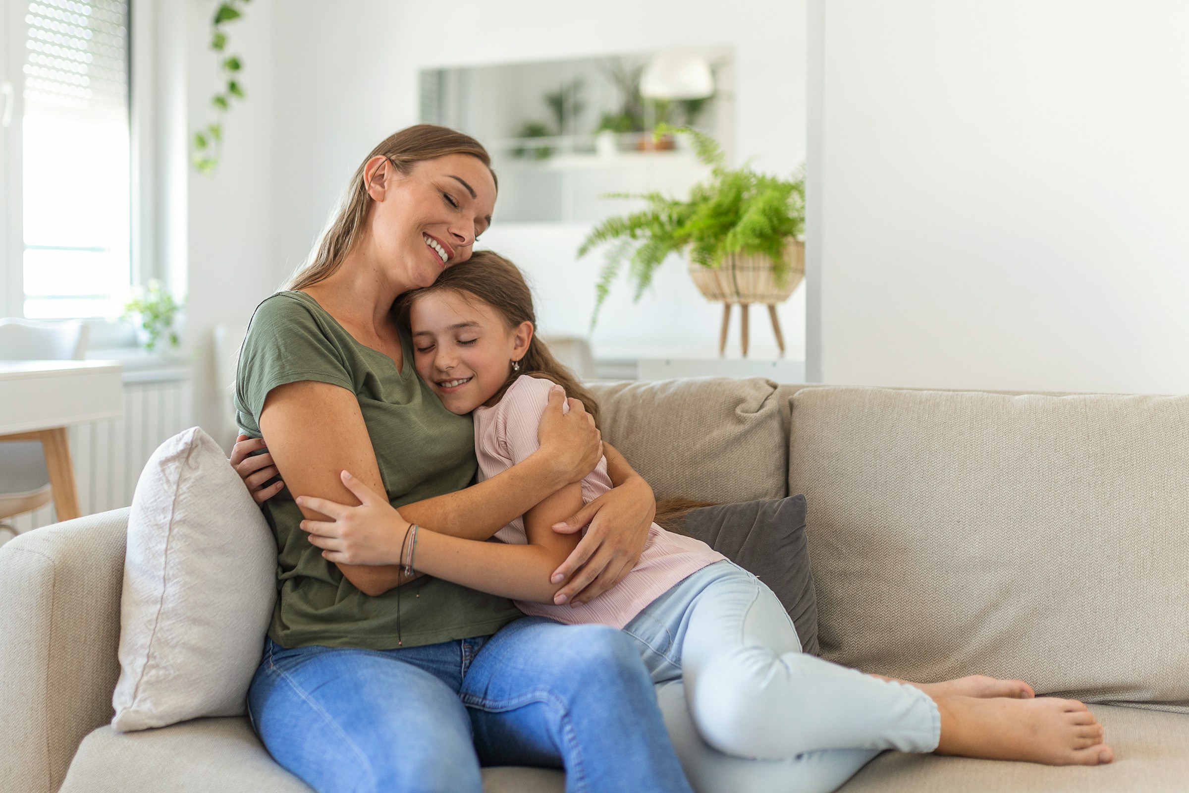 A mother and her child sharing a warm, emotional embrace, capturing a moment of pure connection and safety