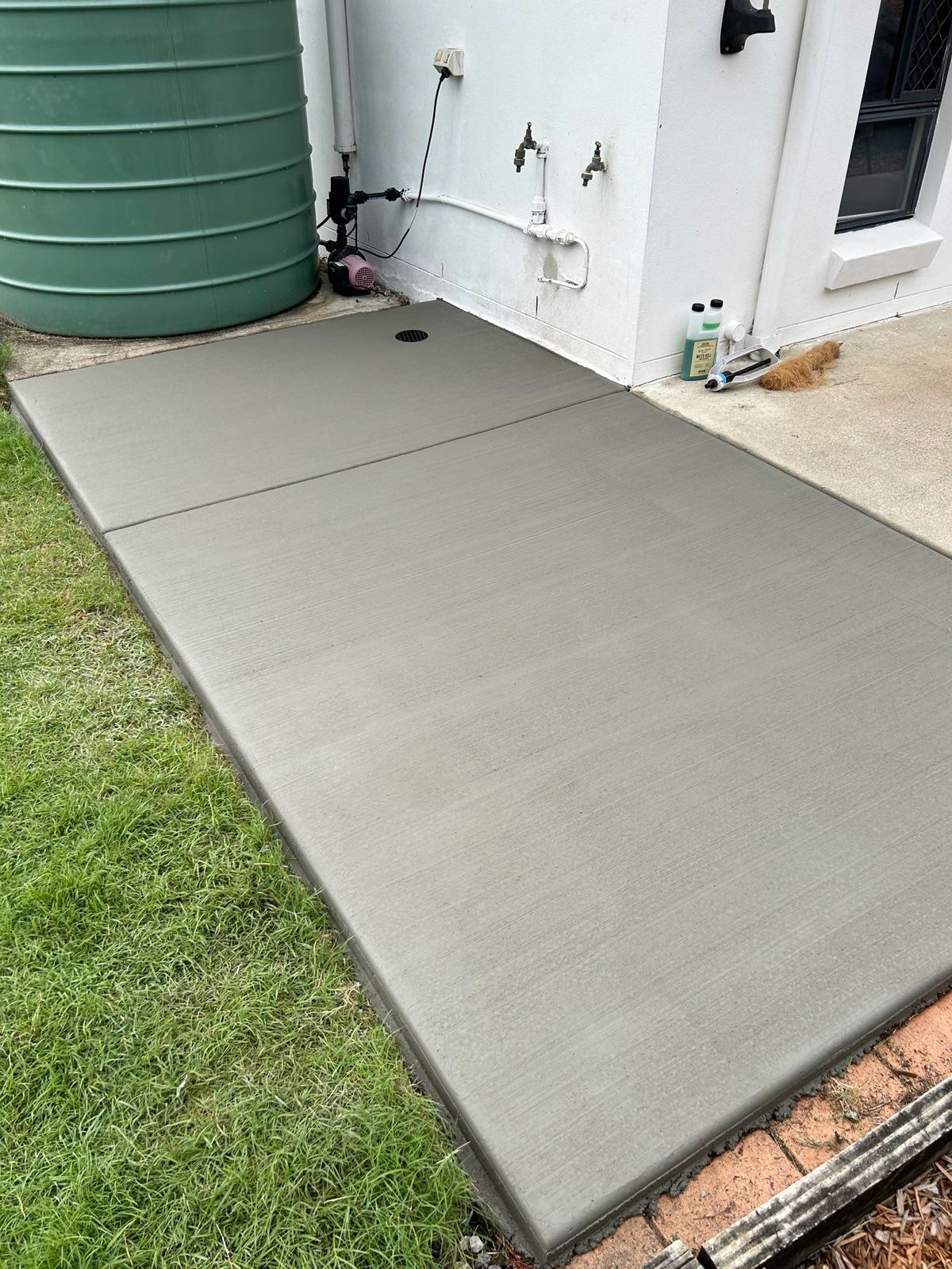 Newly poured and smoothly finished residential concrete footpath in Brisbane
