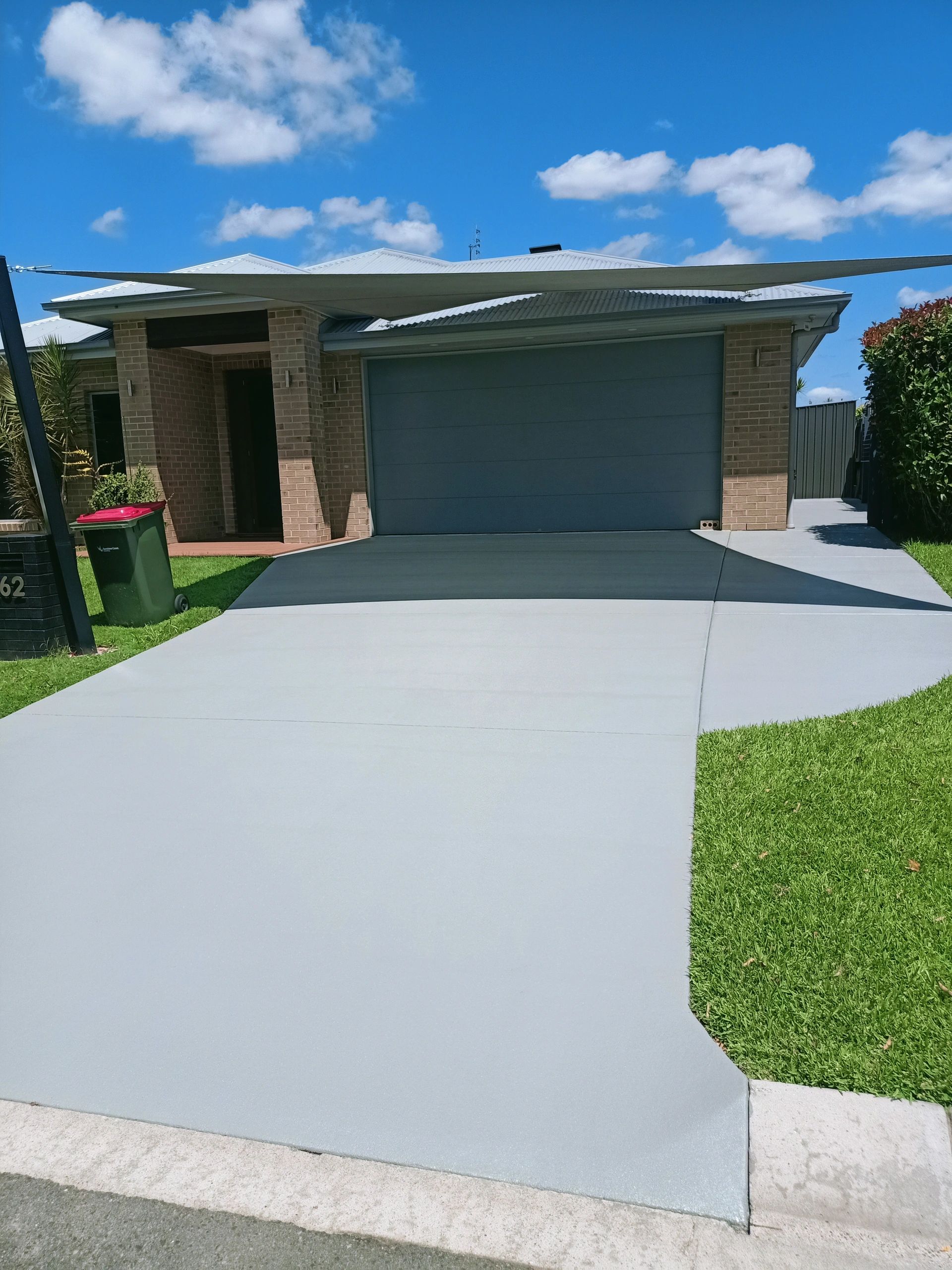 Clear sealed concrete driveway in Moreton Bay
