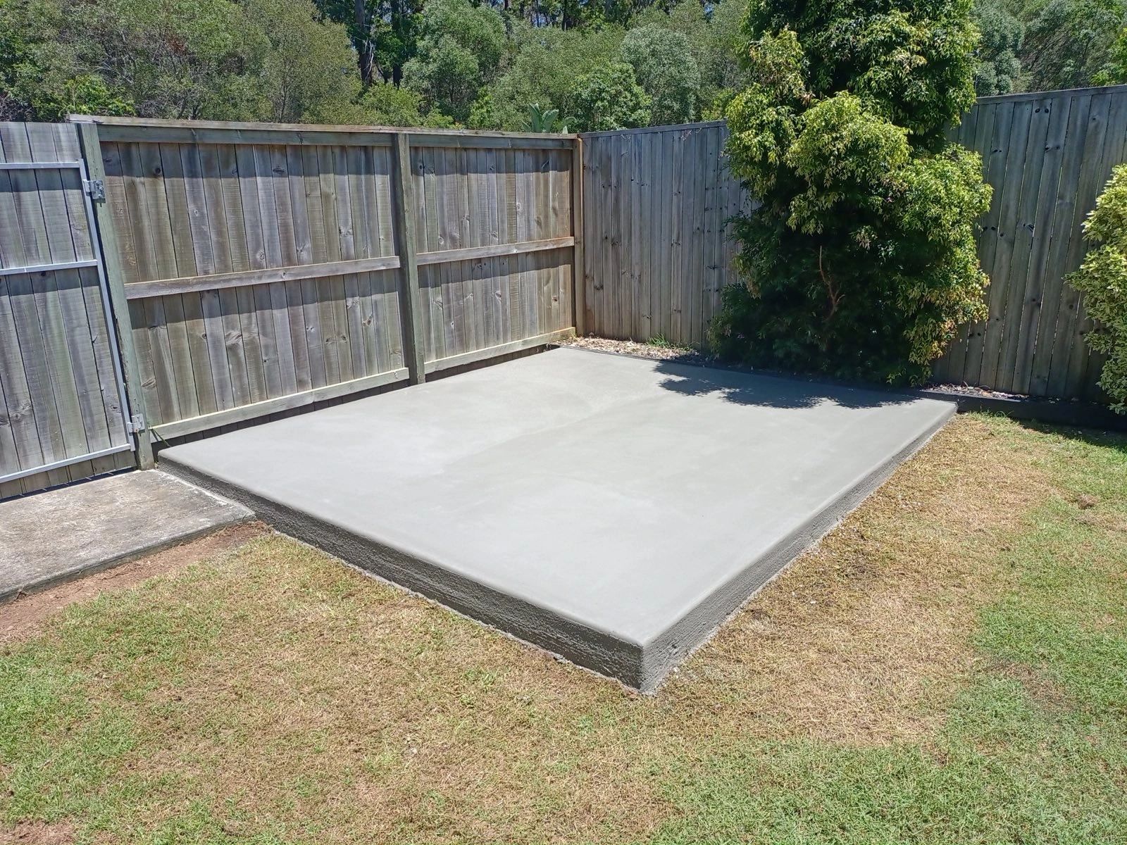 Freshly poured and finished concrete garden shed slab in North Brisbane