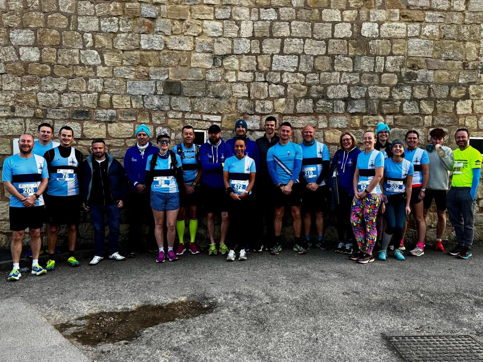 Lindley Running Club members smiling and socialising after a Thursday group run
