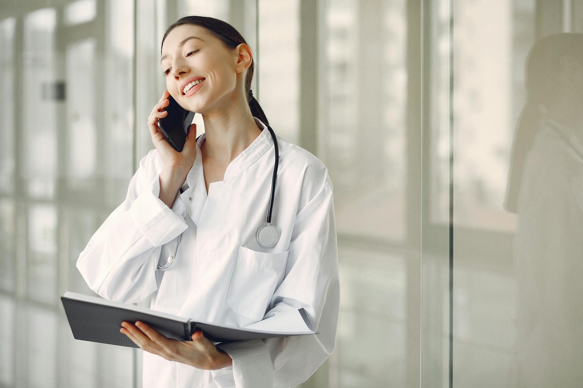 Aesthetic clinic owner on her phone — your AI twin posts 3x a week