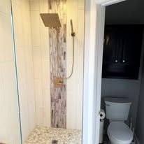Shower installation with tile work in Woodbury, MN by High Quality Plumbing
