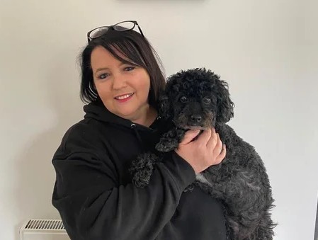 Pam with a beautifully groomed poodle cross