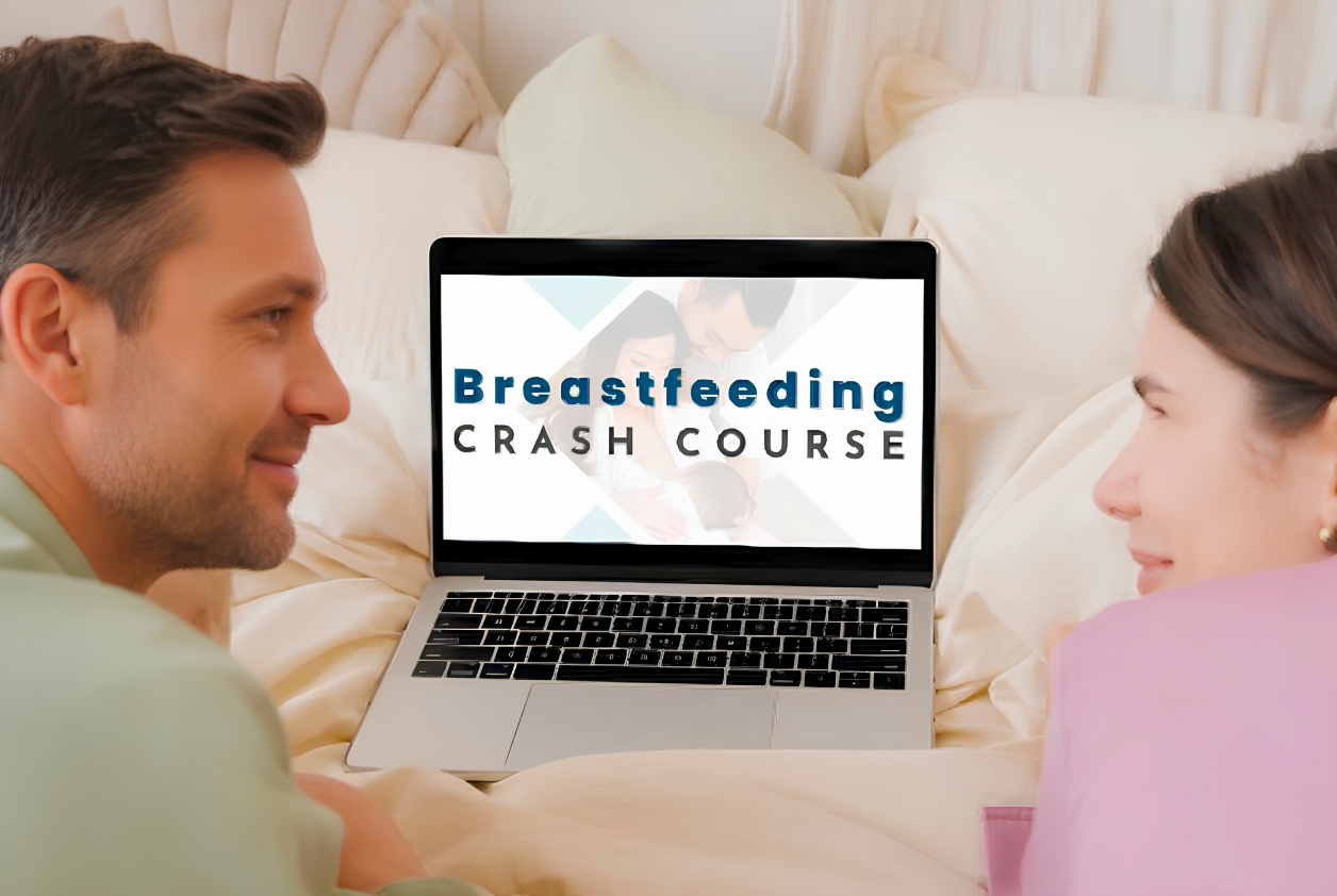 Parents viewing the Breastfeeding Crash Course together on a laptop