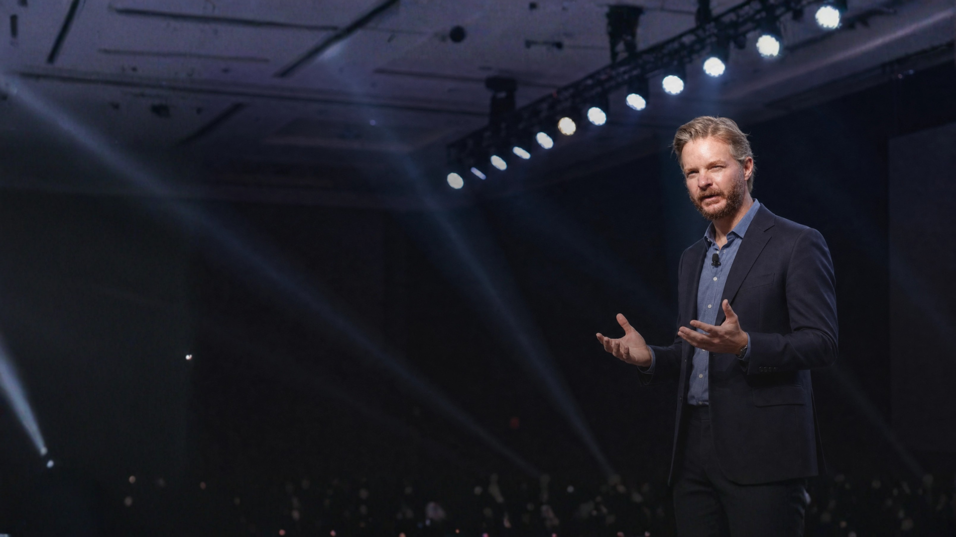 Jeff Sands speaking on stage