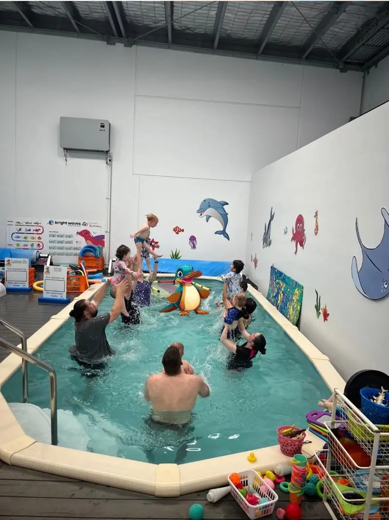 Parent and child in the pool