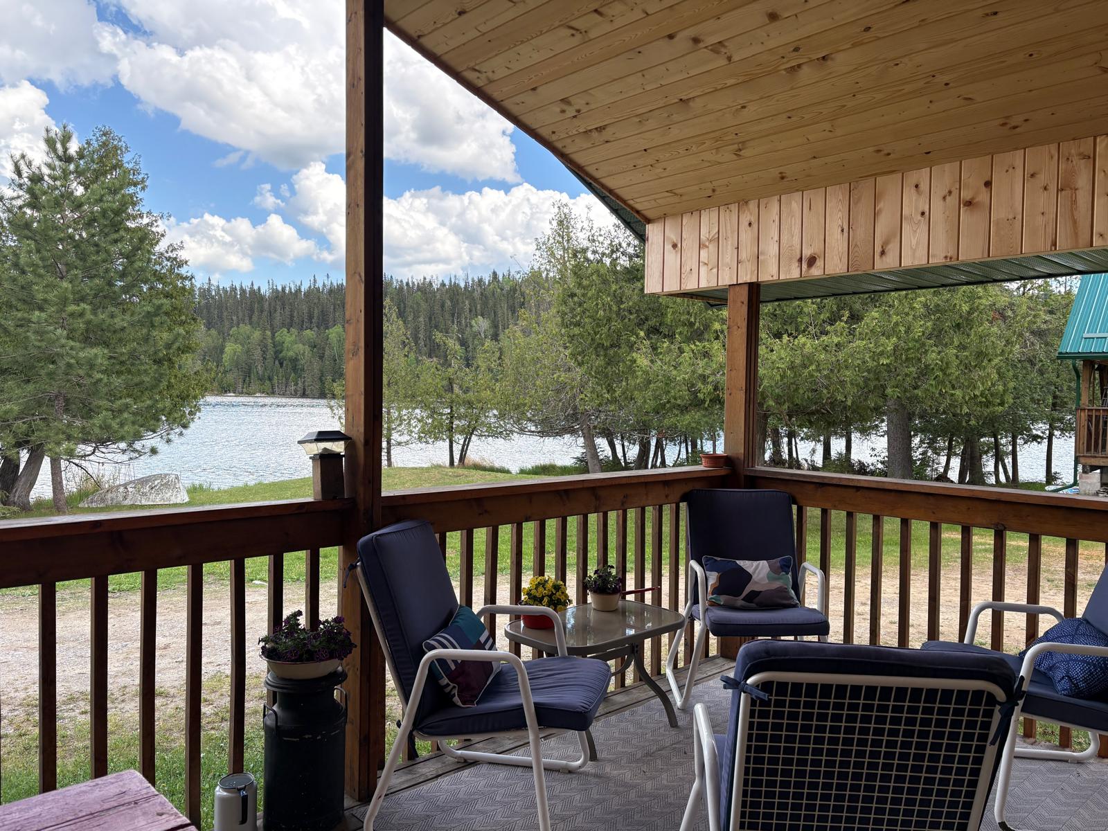 Lakeside deck seating area at Wick Cliff Lodge